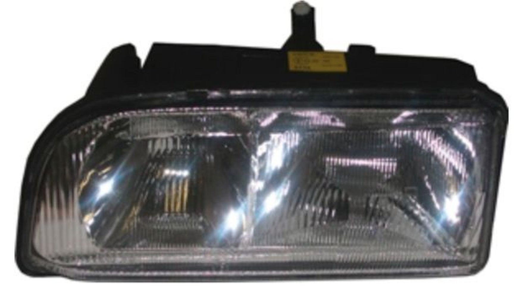 Strålkastare vänster låg högstyrd